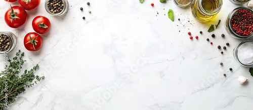 Fototapeta Naklejka Na Ścianę i Meble -   Flat lay of a white marble kitchen counter with food ingredients like tomatoes, herbs, and spices on the sides.