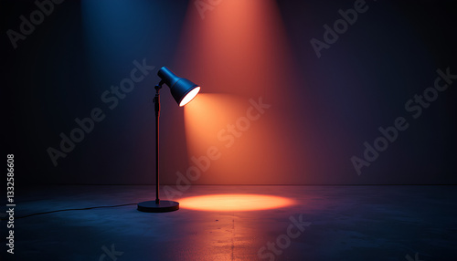 Dark room spotlight black table lamp dramatic lighting focused beam of warm orange light highlighting a specific area on a dark floor