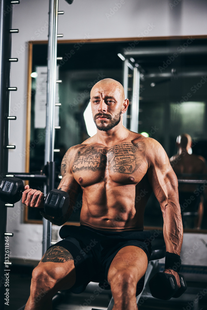 Man Doing Training With Dumbbell For His Arms Muscle At The Gym Man Doing Training With Dumbbell For His Arms Muscle At The Gym