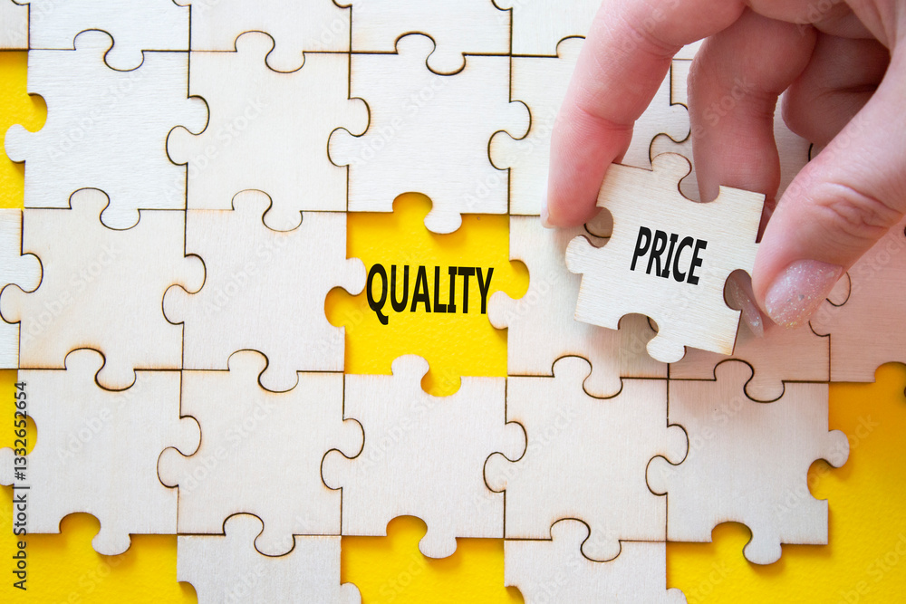 Price or Quality symbol. Concept word Price or Quality on wooden puzzle. Businessman hand. Beautiful yellow background. Business and Price or Quality concept. Copy space