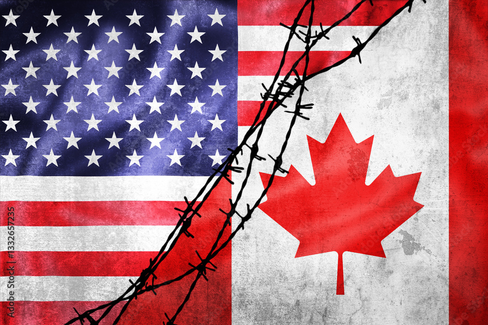 Grunge flags of USA and Canada divided by barb wire illustration
