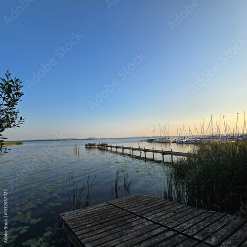 Wallpaper Mural A Serene and Stunning Lakeside View at Sunset Featuring a Pier and a Clear Sky Above Torontodigital.ca