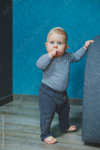 A Curious Toddler Standing in a Modern and Stylish Interior Space that is Brightly Designed