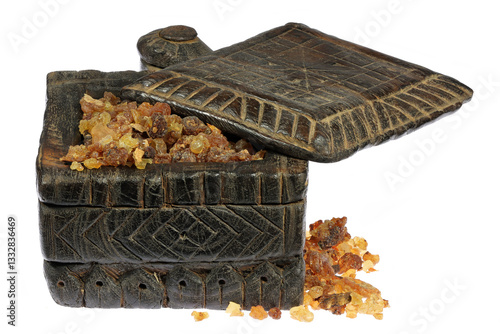 Fotografie myrrh resin from Oman in a wooden box isolated on white background