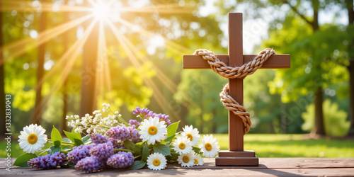 Christian cross in sunlit garden with spring flowers for religious websites, memorial services, Easter celebrations, and faith-based content