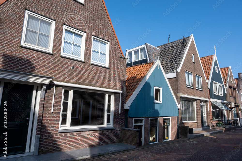 Tourists destination in North Holland, old authentic fishermen village Volendam near Amsterdam with old houses and narrow streets Tourists destination in North Holland, old authentic fishermen village Volendam near Amsterdam with old houses and narrow streets