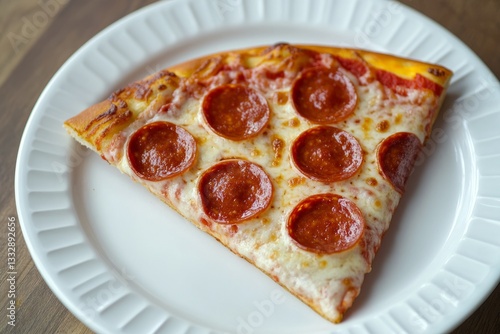 Obraz na płótnie Delicious slice of pepperoni pizza served on a white plate with melted cheese and crispy crust w salonie
