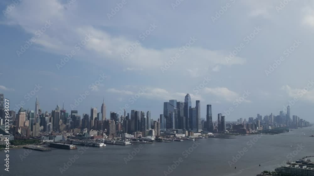 aerial view of new york city skyline (midtown and downtown) from across the hudson river in west jersey (weehawken ferry skyscraper tall building towers) scenic travel tourism destination aerial view of new york city skyline (midtown and downtown) from across the hudson river in west jersey (weehawken ferry skyscraper tall building towers) scenic travel tourism destination