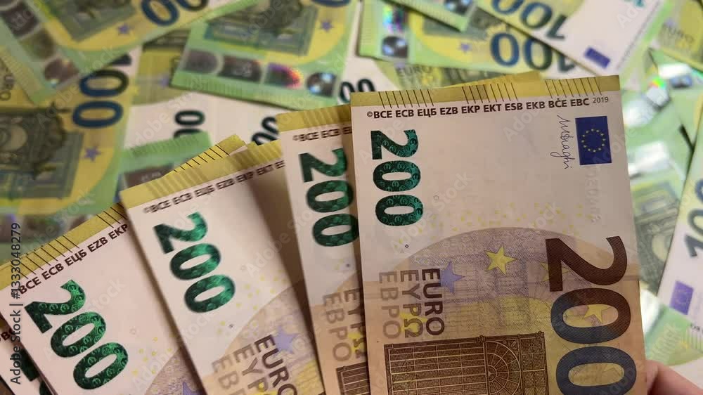 Counting euro banknotes. Female hands count 200 euros cash. Investments, family budget and savings concept Counting euro banknotes. Female hands count 200 euros cash. Investments, family budget and savings concept