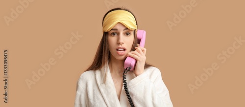 Shocked woman in pajamas an...