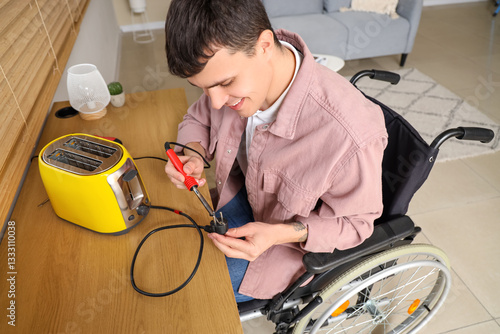Young man in wheelchair rep...