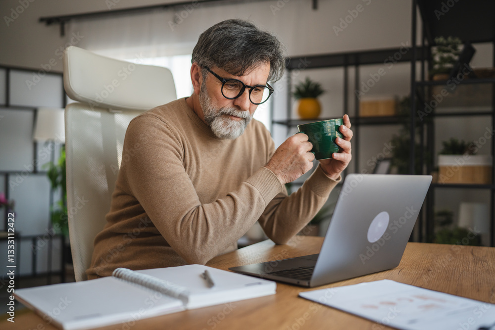 mature senior man relax from work and drink coffee at home office mature senior man relax from work and drink coffee at home office