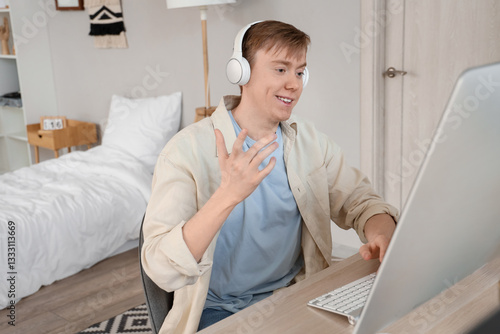 Male student in headphones ...