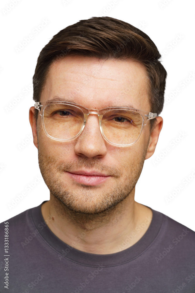 Obraz premium Man with glasses smiling against a bright background captures personal portrait at home