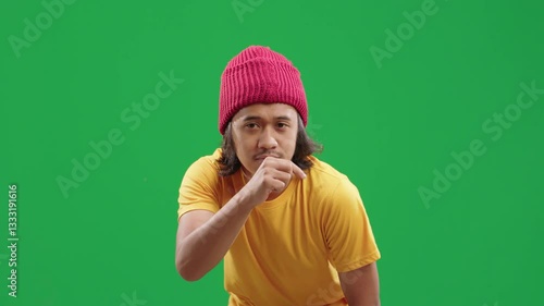 Man in casual outfit interacting with an invisible touchscreen interface on green screen. Various hand movements including tapping, sliding, and swiping. Green screen, ads, smart technology, interface