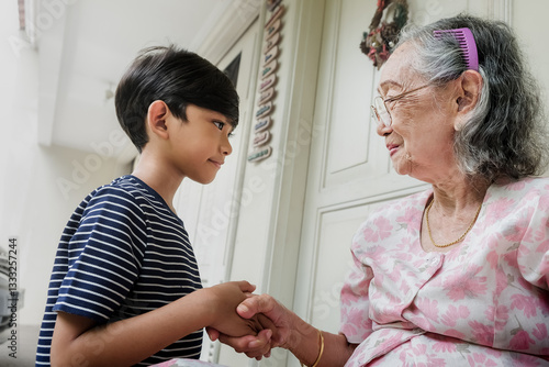 Canvastavla An Indonesian boy greeting his grandmother with a handshake