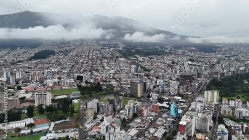 Aerial footage of the city Quito in Ecuador with the Volcan mountain on background