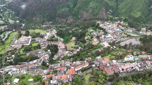 Aerial footage of the city Quito in Ecuador with the Volcan mountain on background
