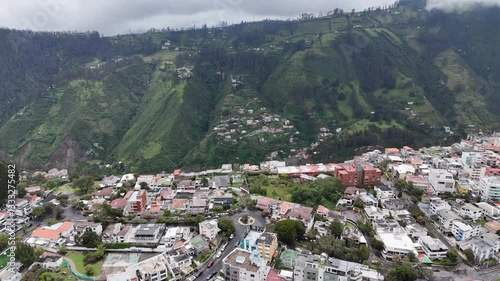 Aerial footage of the city Quito in Ecuador with the Volcan mountain on background