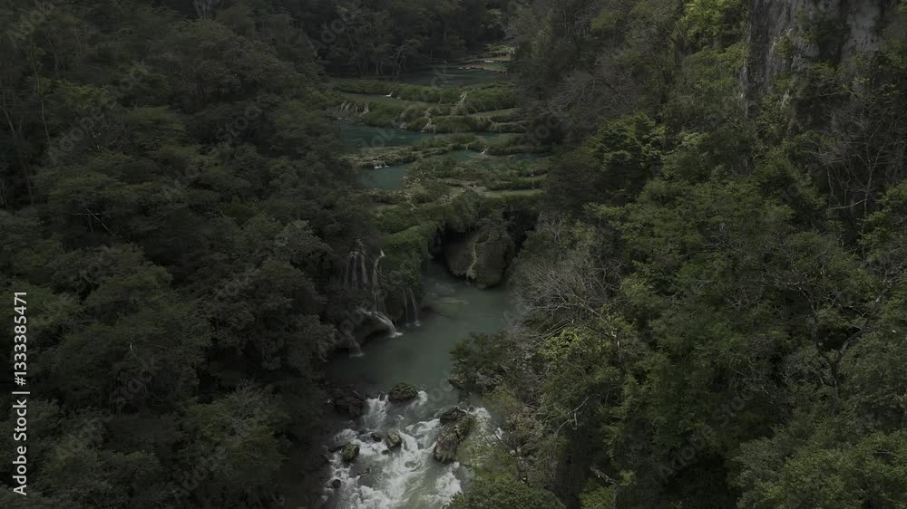 Drone hovers over Cahabon River and pans down over rapids in Semuc Champey, Guatemala Drone hovers over Cahabon River and pans down over rapids in Semuc Champey, Guatemala