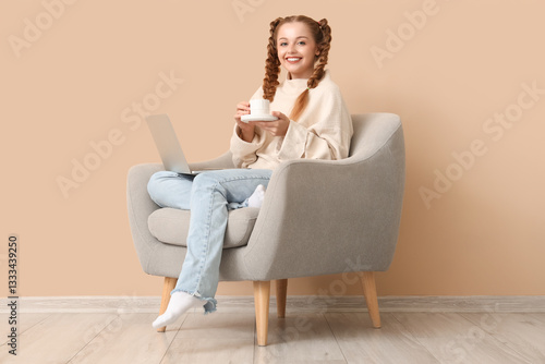 Happy young woman with cup ...