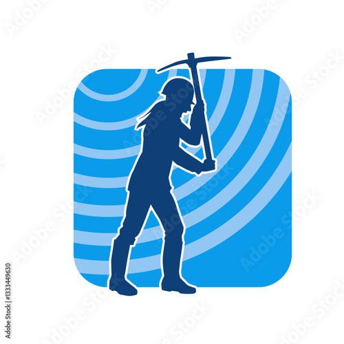 Silhouette of a construction worker in action with a pick axe tool. Silhouette of a miner labour in heavy duty work.