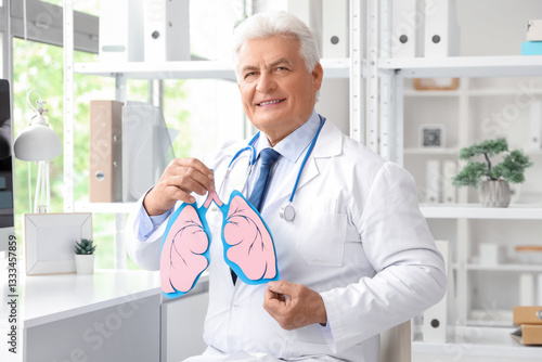 Mature doctor with paper lu...