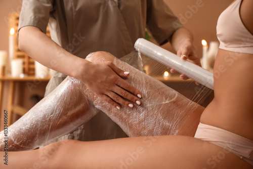 Massage therapist wrapping ...