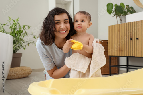 Happy Mother Holding Baby A...