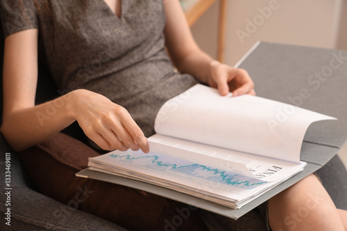 Businesswoman reviewing fin...