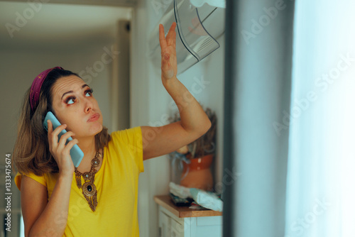 Konstfotografi Woman with Broken Air Conditioning Calling the Repair Service