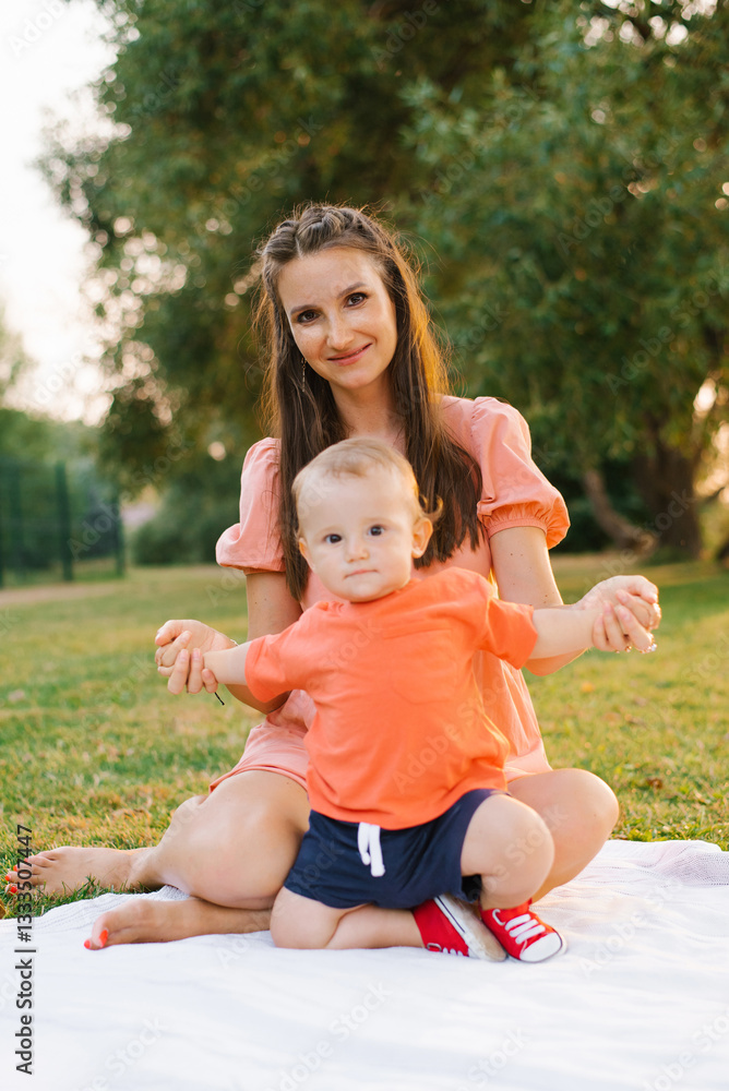 Mother And Toddler Smiling Outdoors