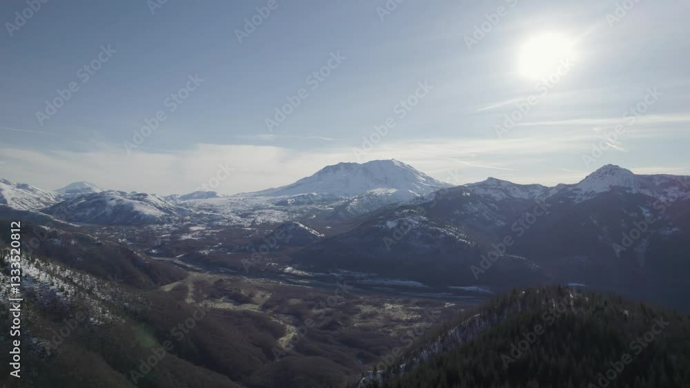 Aerial: Mount St. Helens in winter with sun shining and snow during the day in Skamania County, Washington, USA, orbit drone shot Aerial: Mount St. Helens in winter with sun shining and snow during the day in Skamania County, Washington, USA, orbit drone shot