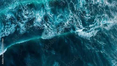Aerial View of Turbulent Ocean Waves Crashing and Swirling, Creating Intricate Patterns Deep Blue and Turquoise Hues, Dynamic Movement of Water Conveys Sense of Power and Natural Beauty