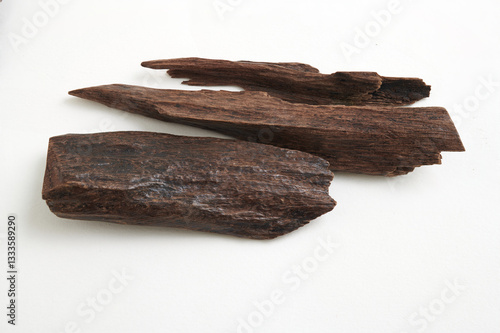 Oud Fragrant Wood isolated on white background (Full depth of field) – Traditional Agarwood for Incense Burning
