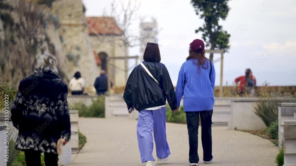 People walking on the streets of the city in daylight in Antibes, France People walking on the streets of the city in daylight in Antibes, France