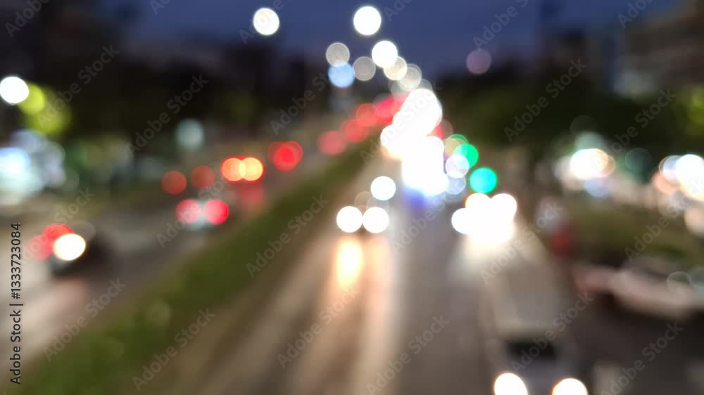 Blurred Cityscape: A vibrant, out-of-focus shot of a bustling city thoroughfare at night, where the light of vehicles and street lamps creates an abstract tapestry of color. Blurred Cityscape: A vibrant, out-of-focus shot of a bustling city thoroughfare at night, where the light of vehicles and street lamps creates an abstract tapestry of color.
