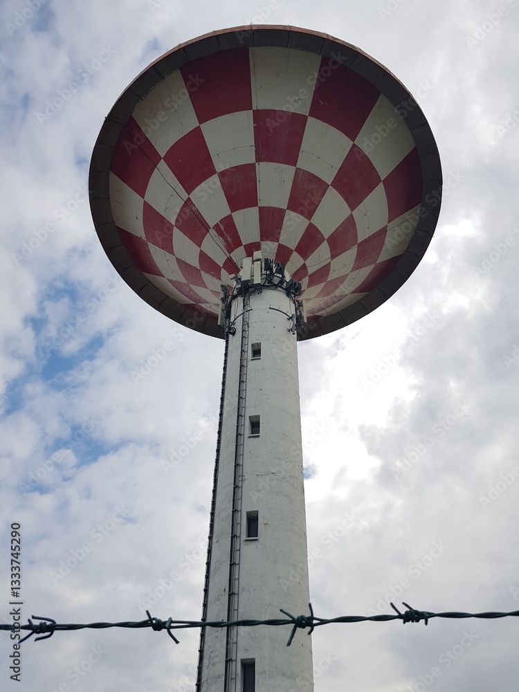 Water tower against the backdrop of the blue sky
