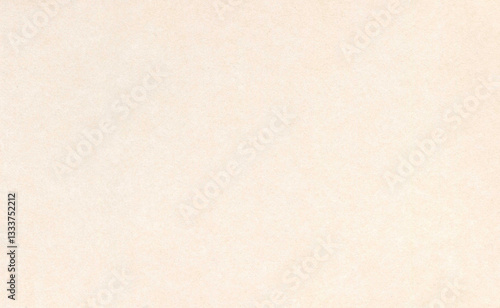 Surface of an old paper or cardboard, background, texture. Backdrop of yellowed paper surface with elements of aging. Old yellowed paper piece. Ancient wall. Smooth but faded paper surface
