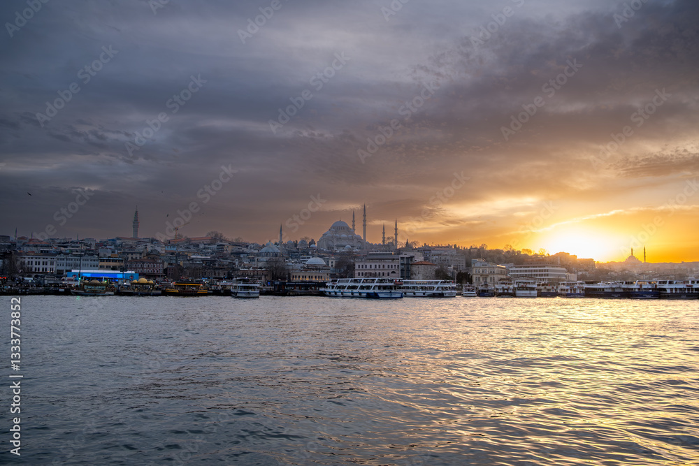 Eminönü Sunset: Suleymaniye Mosque Silhouette, Ferries & Tour Boats on Golden Horn, Istanbul Evening Scene Eminönü Sunset: Suleymaniye Mosque Silhouette, Ferries & Tour Boats on Golden Horn, Istanbul Evening Scene