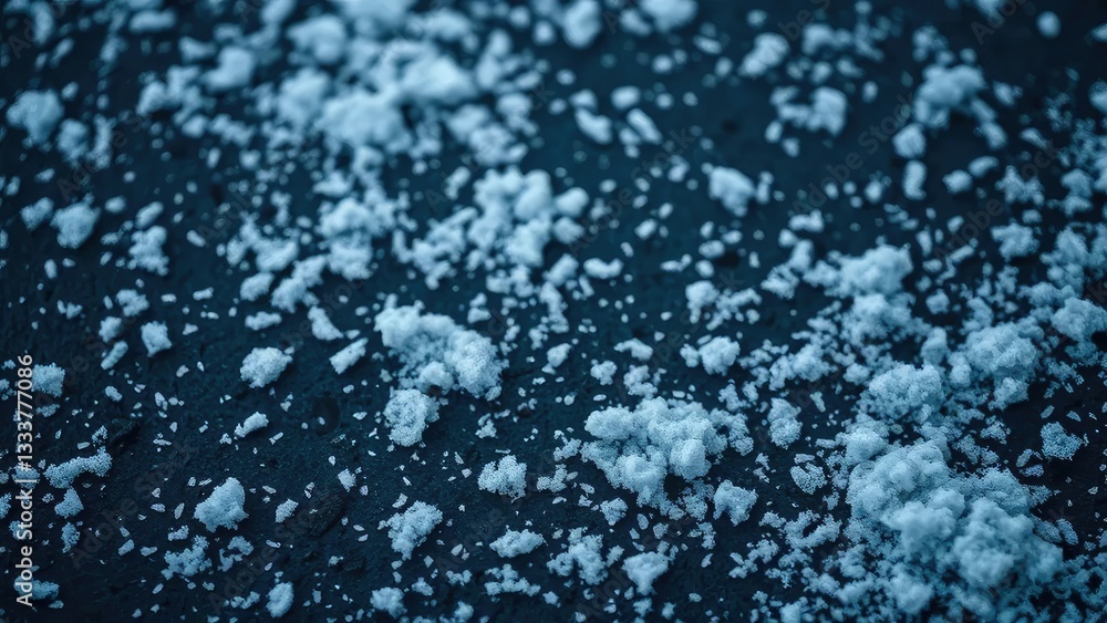 Delicate flakes gently fall on dark snowy ground, serene, white flakes Delicate flakes gently fall on dark snowy ground, serene, white flakes