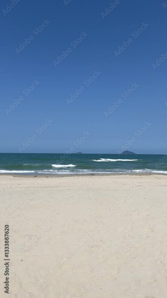 Beautiful tropical beach with blue sky and white cloud background. Summer vacation and nature environment concept.