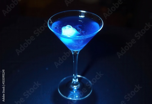 Wallpaper Mural Vibrant blue cocktail with an ice cube in a martini glass. Torontodigital.ca