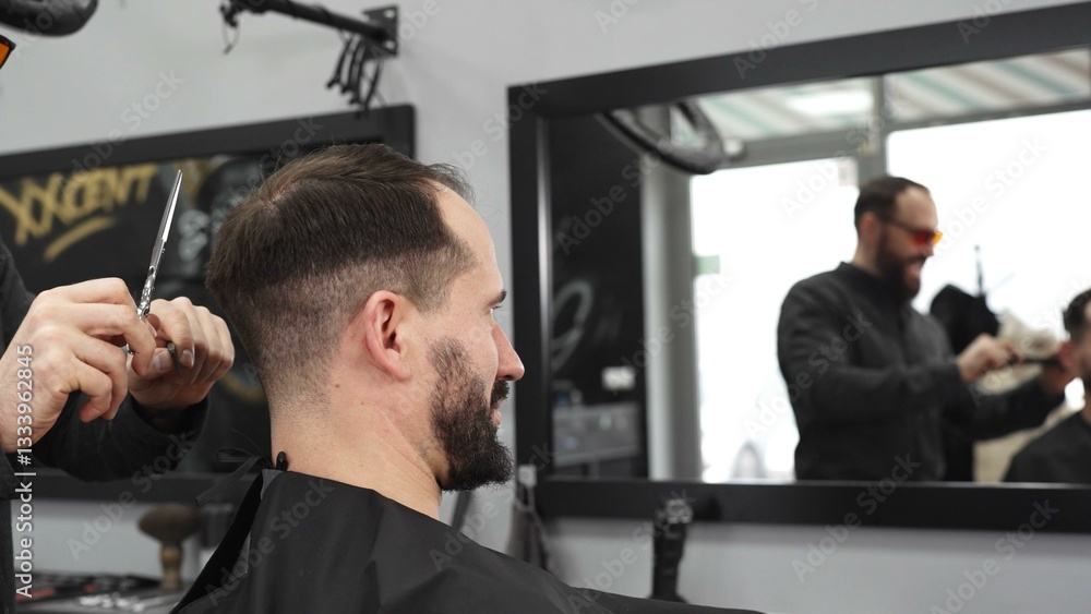 Skilled barber trimming client's hair using professional scissors, creating contemporary hairstyle in modern barbershop setting with precise, professional technique.
