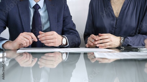 Obraz na płótnie Business partners or lawyers are reviewing contract terms during a meeting, negotiating and making decisions together. Business people concept, close up view w salonie