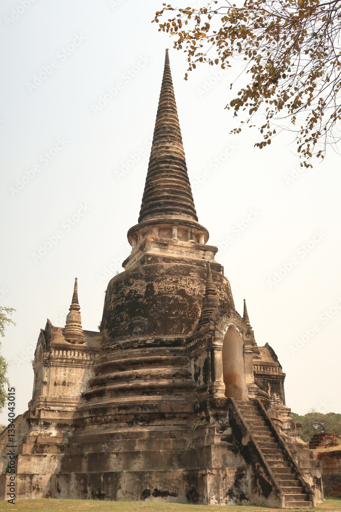 Fototapeta premium View onto one of the stupas, pagodas of the Wat Phra Si Sanphet Temple, Ayutthaya Historical Park, Thailand