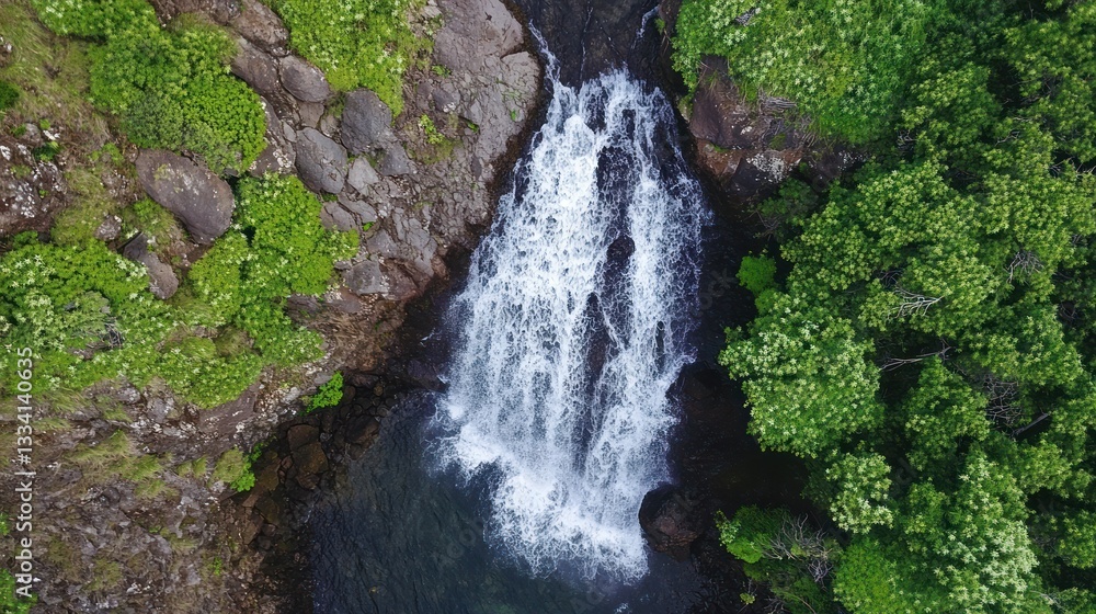 A beautiful waterfall cascades into a cool dark pool of water A beautiful waterfall cascades into a cool dark pool of water