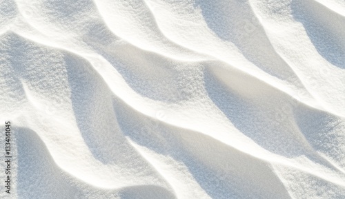 White sand dunes texture. Detailed close-up view of rippled white sand formations