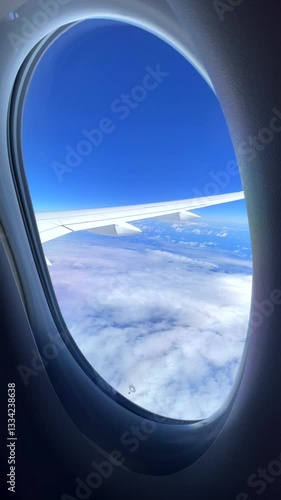 Airplane Window Frame View of Clouds 