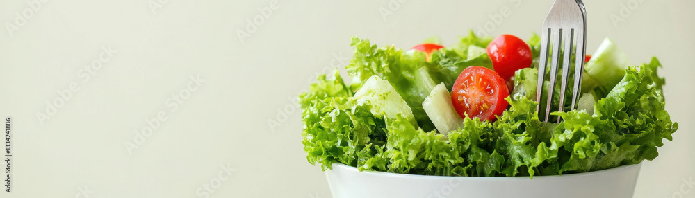 Fresh green salad with tomatoes and cucumber in bowl Fresh green salad with tomatoes and cucumber in bowl